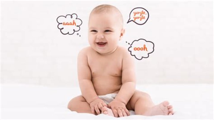 When do babies start cooing and smiling?